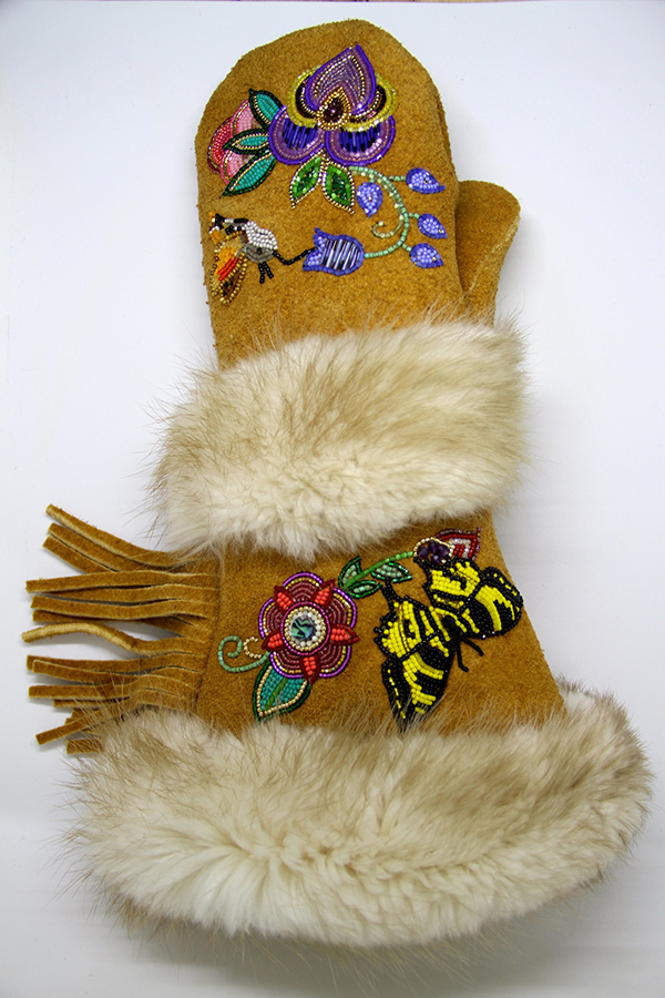 Made of tanned moose hide, porcupine quills, and fur by Yukon artist Vashti Etzel. Part of the Yukon Permanent Art Collection.